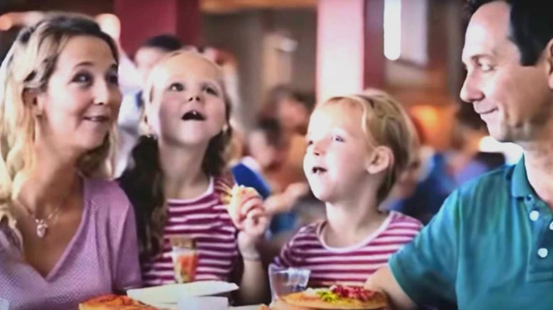 Pizza eating family looking strange