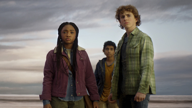 Annabeth, Grover, and Percy standing