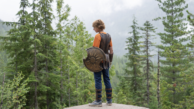 Percy with shield in forest