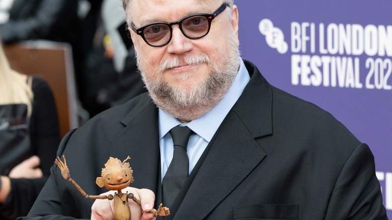 Guillermo del Toro with a Pinocchio puppet