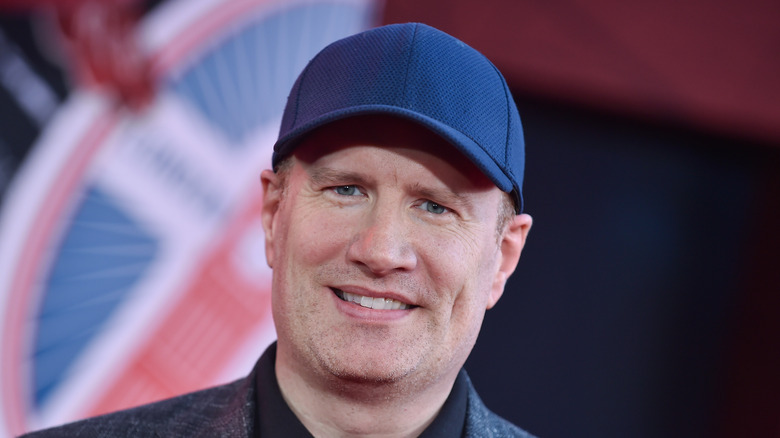 Kevin Feige wearing a hat and smiling