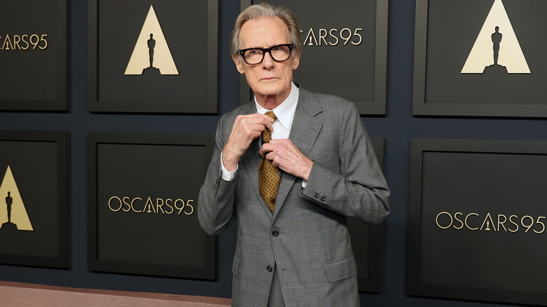 Bill Nighy adjusting his tie