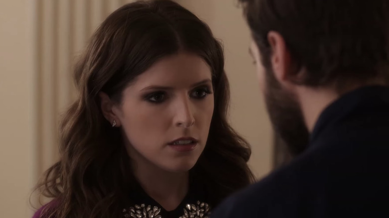 Beca looks down