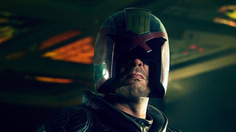 Judge Dredd scowls under helmet