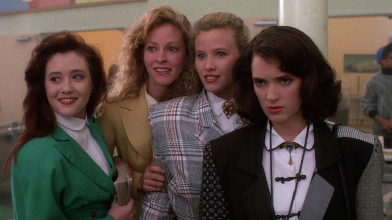 Veronica standing with the Heathers