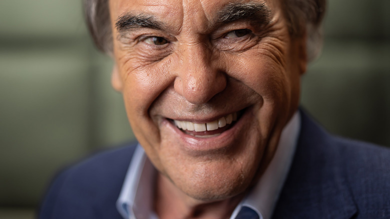 Oliver Stone laughing 