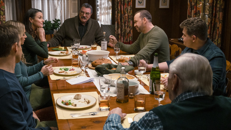 The Reagan family sitting together at the dinner table