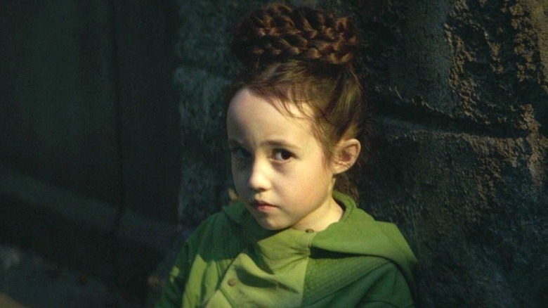 Young Leia wearing green coat