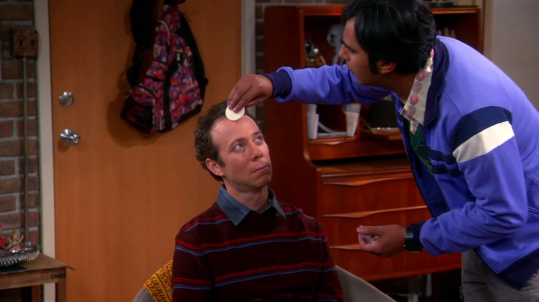 Raj putting makeup on Stuart