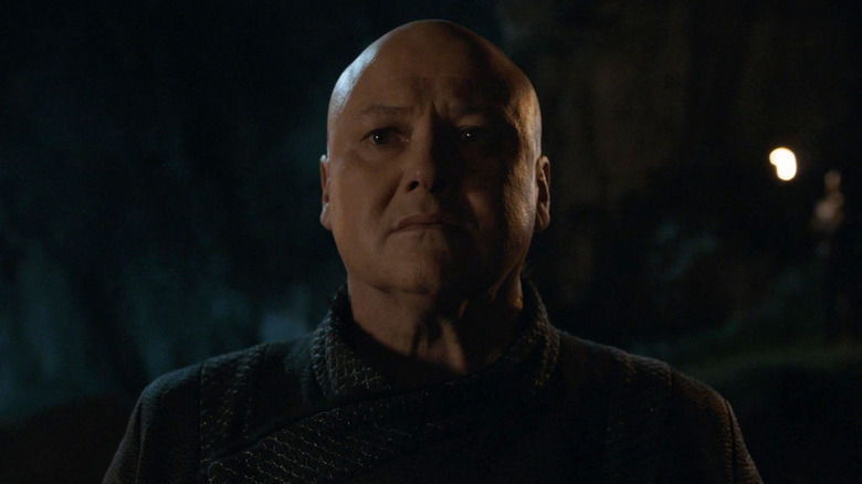 Varys looking anxious in firelight