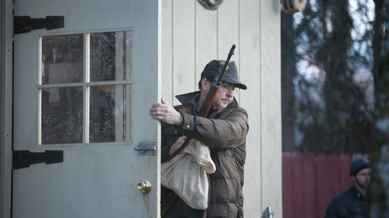 John Cusack holds door