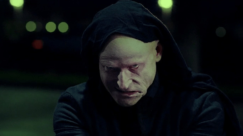 Crispin Glover wears a hood