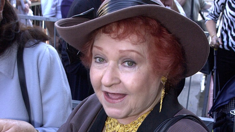 Estelle Harris wearing a hat