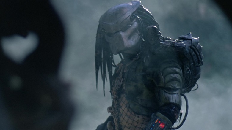 The Predator in its mask and suit