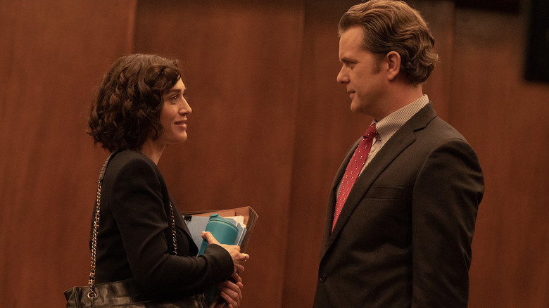 Lizzy Caplan Joshua Jackson smile at each other in profile