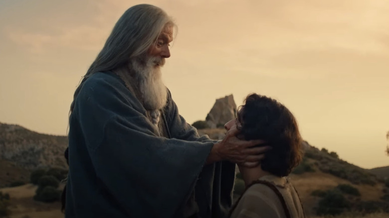 David kneels before an old man in a robe in "House of David" (2025)