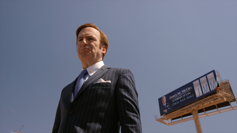 Saul stood by billboard