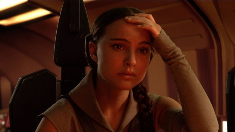 Padme holds her head