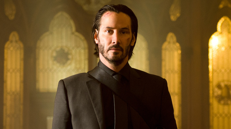 John Wick standing in church