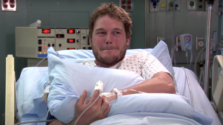 Andy Dwyer holding pillow