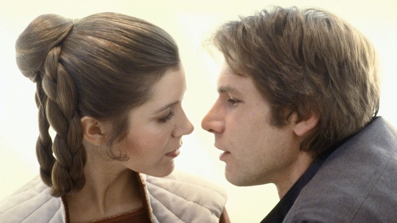 Leia and Han lean in for kiss