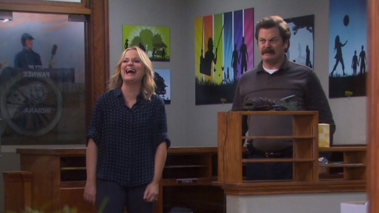 Amy Poehler laughing, Nick Offerman horrified