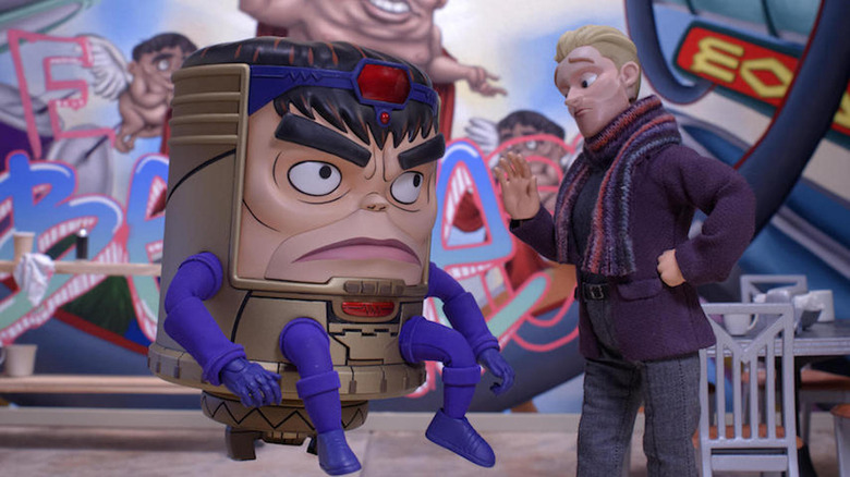 Marvel's MODOK talking to man with blond hair