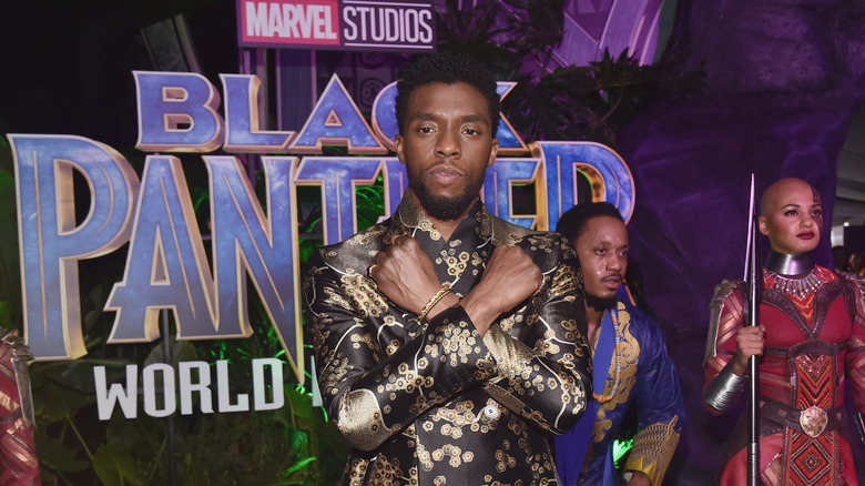 Chadwick Boseman with arms crossed