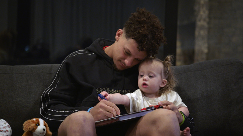 Patrick Mahomes playing with his daughter