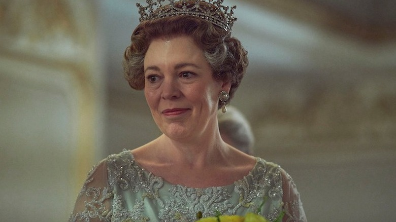 Olivia Colman as Queen Elizabeth II smiling