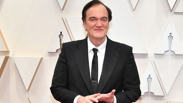 Tarantino poses at event 