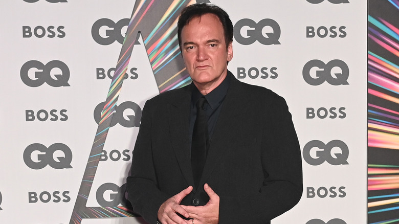 Tarantino poses at event 