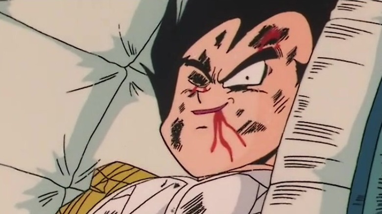 An injured Vegeta smirks