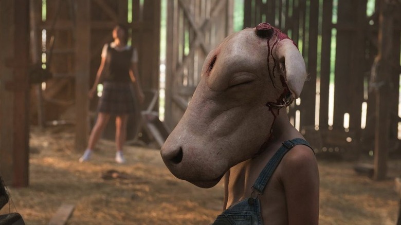 Leatherface wearing an animal head