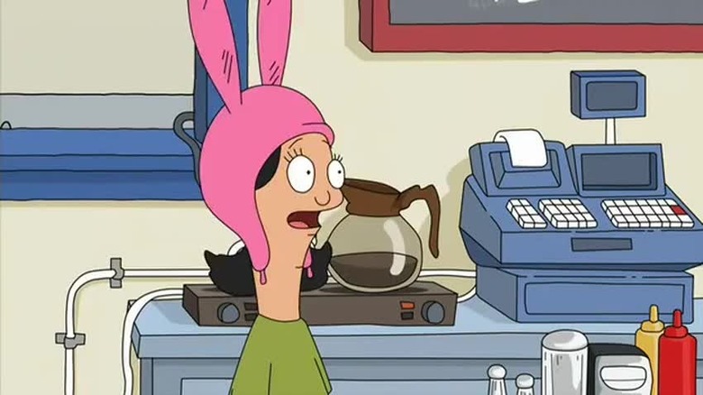 Louise behind the counter in episode one