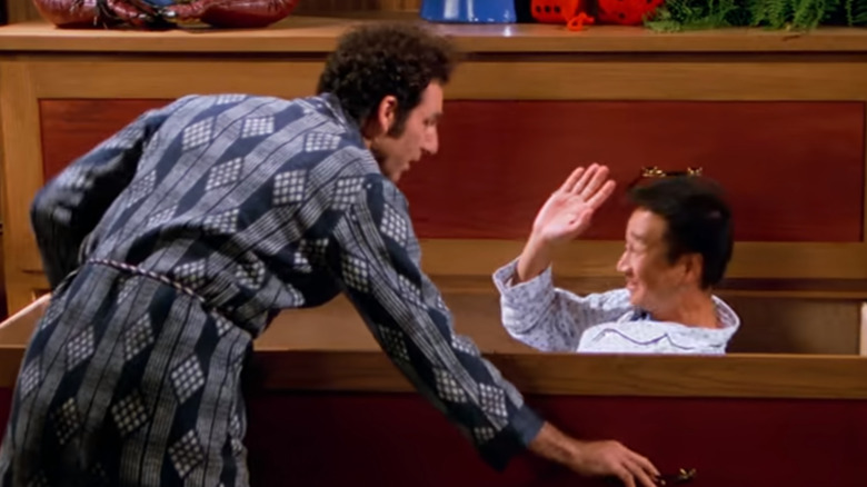 Cosmo Kramer saying goodnight to his Japanese guest sleeping in a drawer