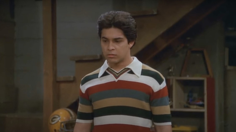 Fez in striped shirt