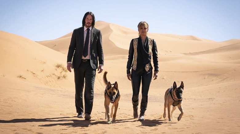 John and Sofia in the desert with her dogs