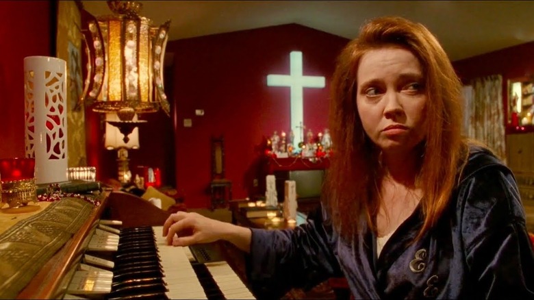 Religious woman playing piano