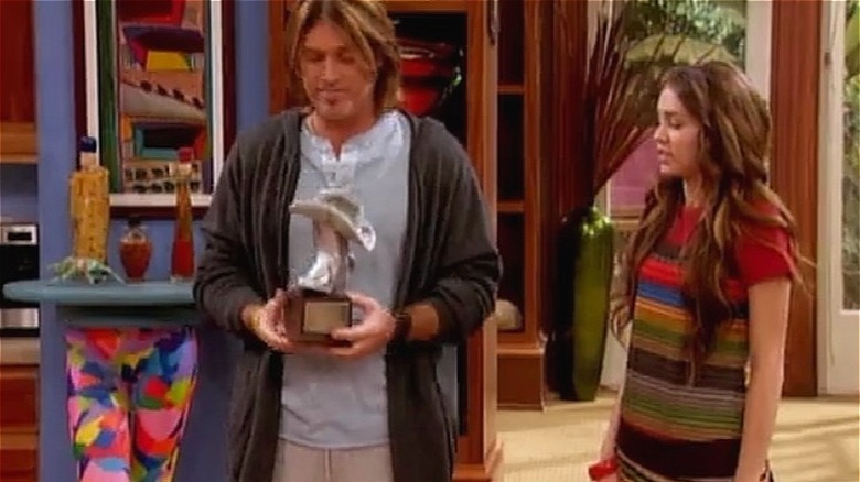 Robby holds Silver Boot