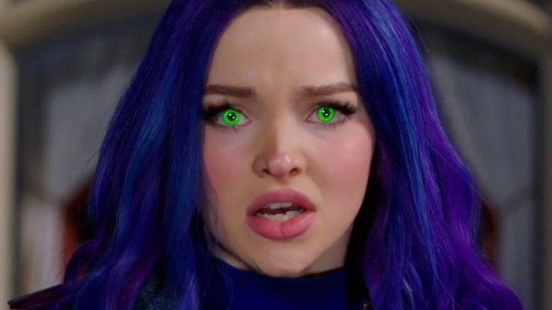 Mal with glowing green eyes