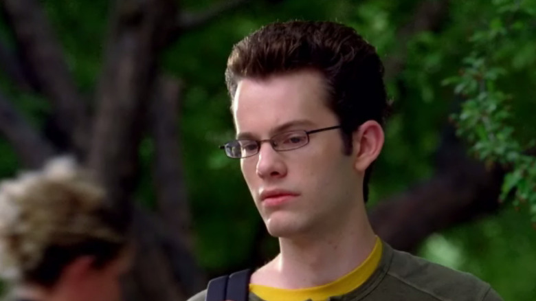 Dylan in front of trees