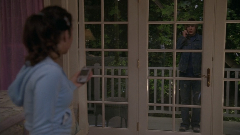 Troy outside on Gabriella's balcony