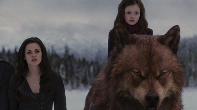 Bella next to Renesmee on Jacob