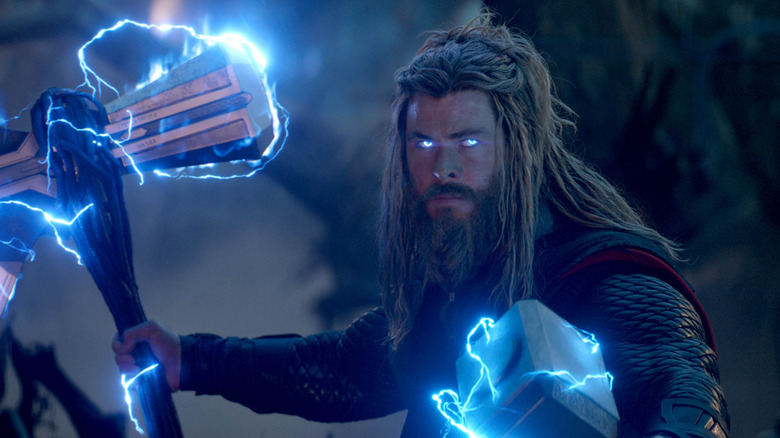 Thor holding Stormbreaker and Mjolnir