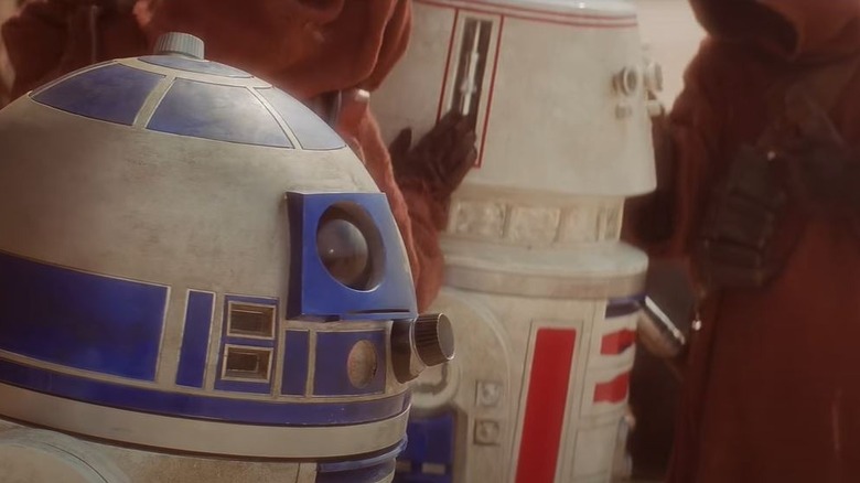 R2-D2 standing next to R5-D4