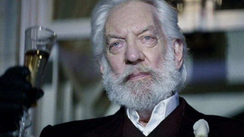 President Snow holding up his glass