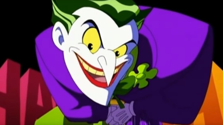 the joker leans forward