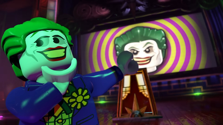 lego joker smiling and pointing