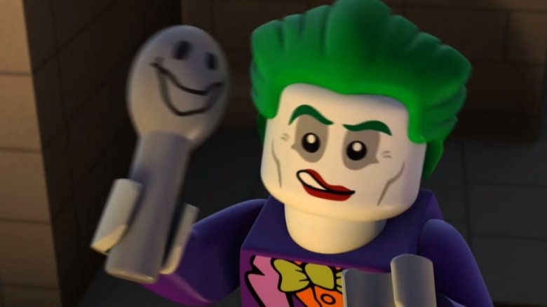 the joker holds spoon